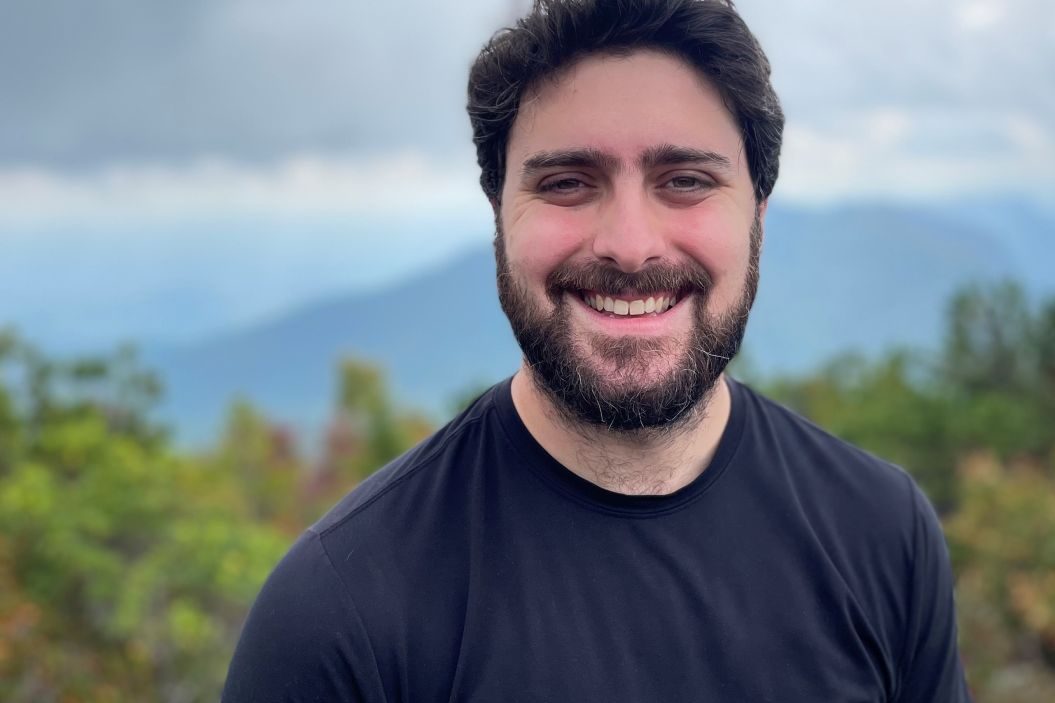 Jean-Philippe Gibert with forest and mountains in the background