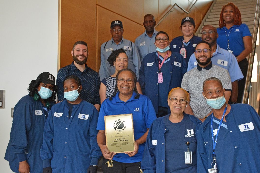 Staff from Duke University's Environmental Services team holding the Green Seal Certification plaque.