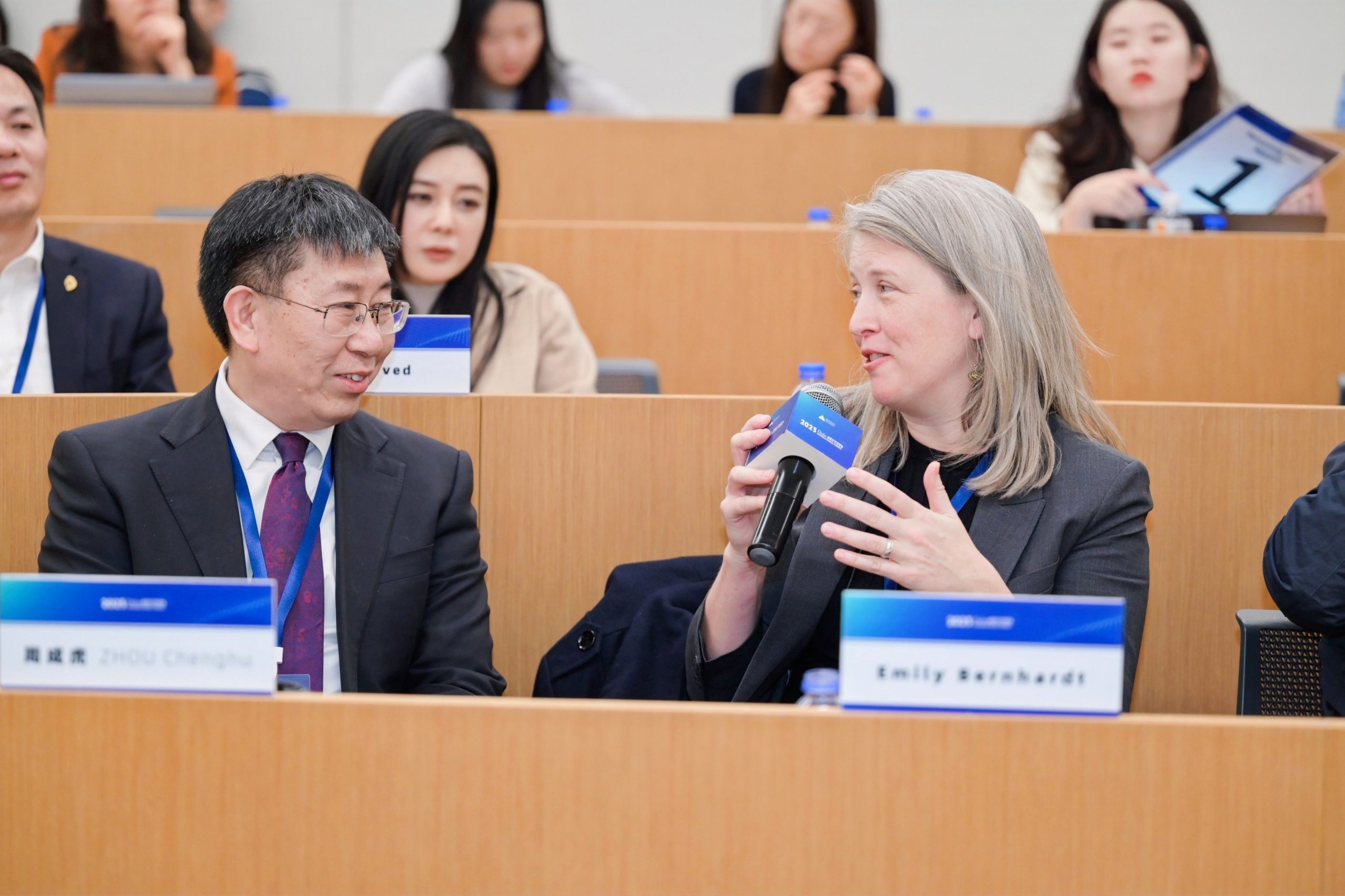 Emily Bernhardt speaking with Chenghui Zhou during The Duke International Forum.