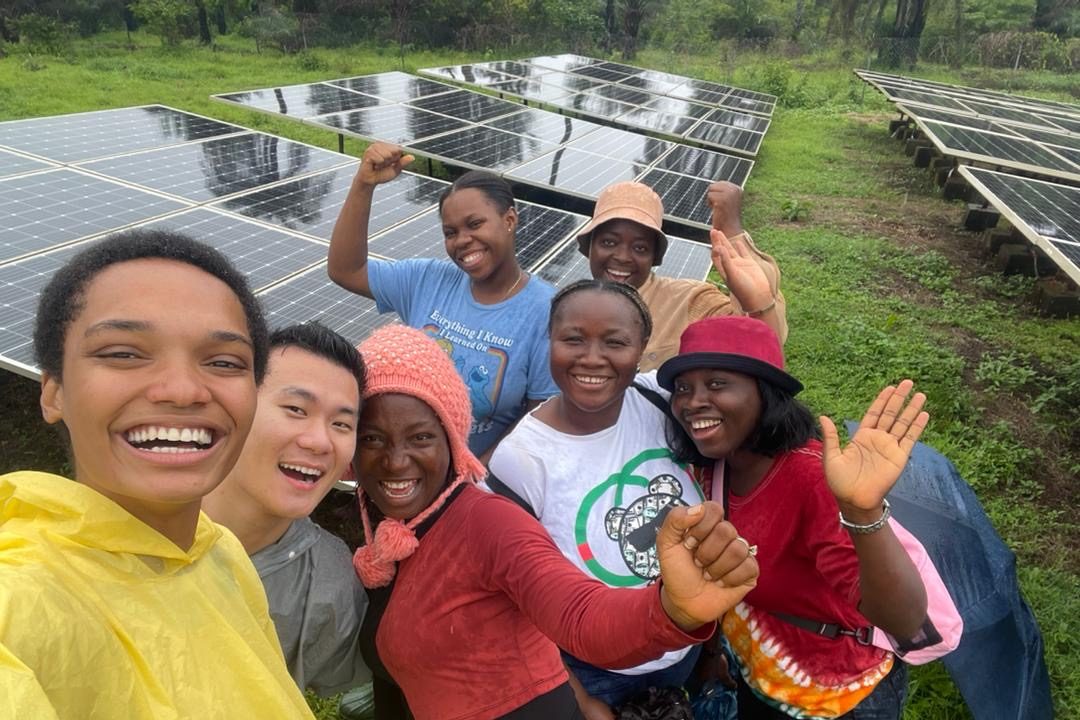 Students in front of solar panels