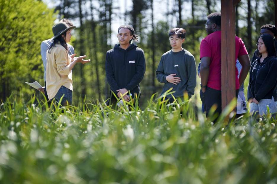 Saskia Cornes giving a talk at Duke Campus Farm to French students