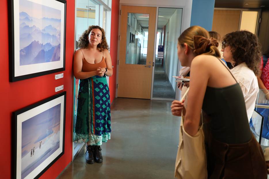 Student giving an photo art talk to audience